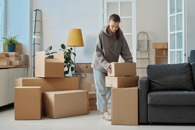 Woman packing boxes for moving