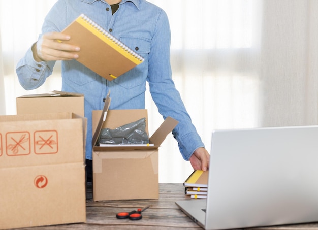 Woman packing order in her home office