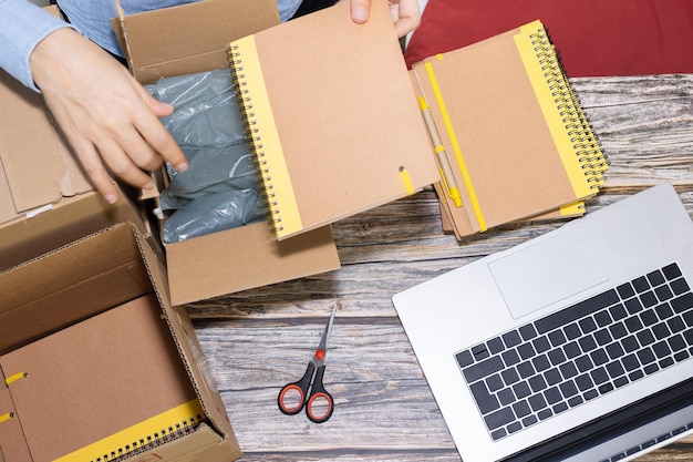 Woman packing order in her home office