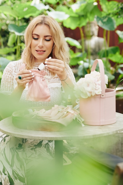 Woman packing organic cosmetics