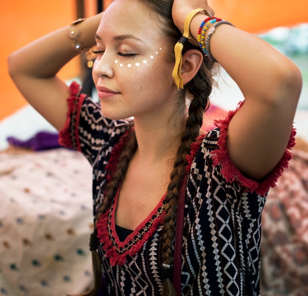 Woman painting face for party hanging out