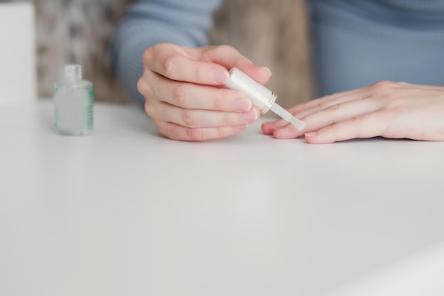 Woman painting her nails