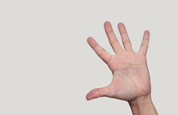 woman palms hands fingers isolated on light beige ivory background.wrinkled pruney fingers from stay