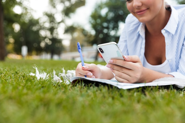 Woman in park outdoors mobile phone.