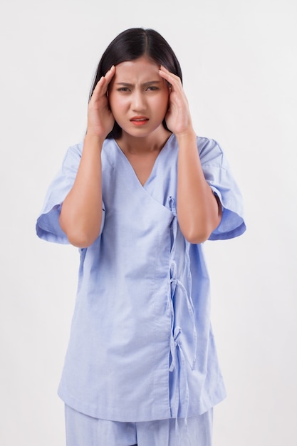 Woman patient suffering from headache