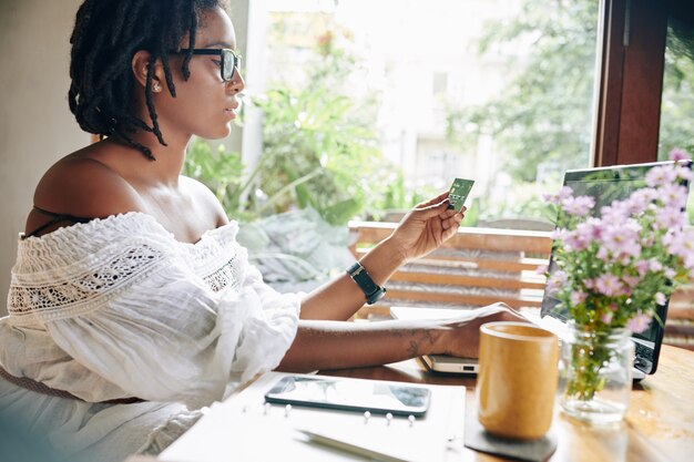 Woman paying online on laptop