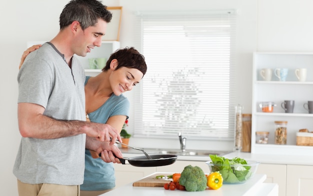 Woman peeking over her husband's shoulder