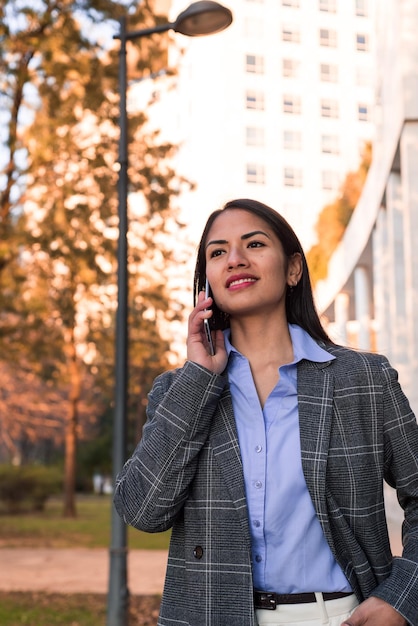 A woman on the phone in the city