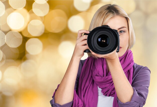 Woman-photographer takes images, isolated