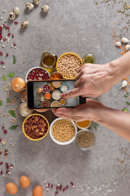 Woman photographs the ingredients of the diet