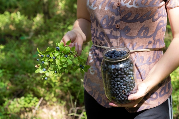 Woman picking blueberrys.