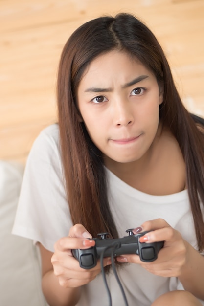 woman playing console video game