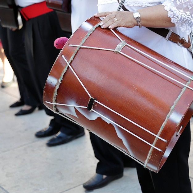 Woman playing the drum in a parade