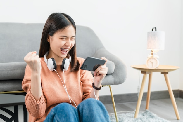 Woman playing games on her smartphone