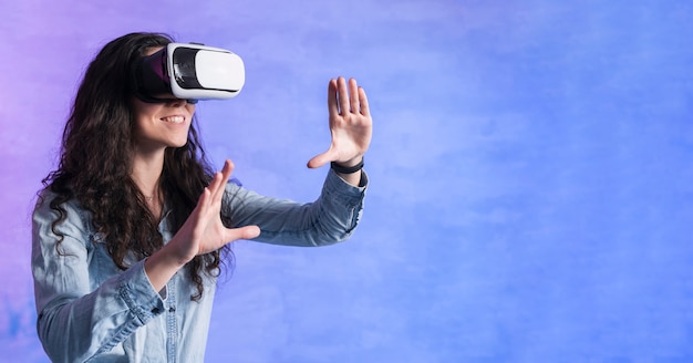 Woman playing games on vr set and copy space room