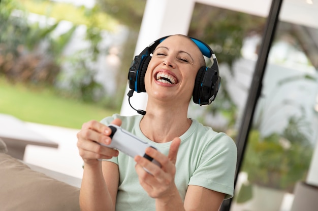 Woman playing a video game with her console