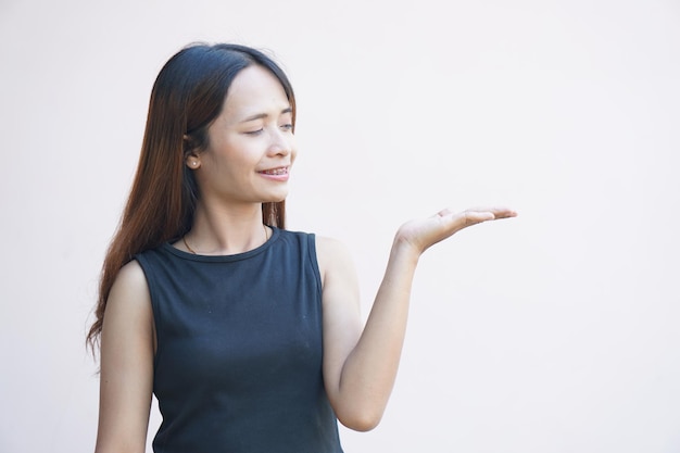 Woman pointing a finger to the side like a commodity