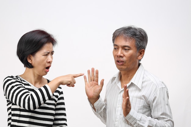 Woman pointing her finger against and blame her husband