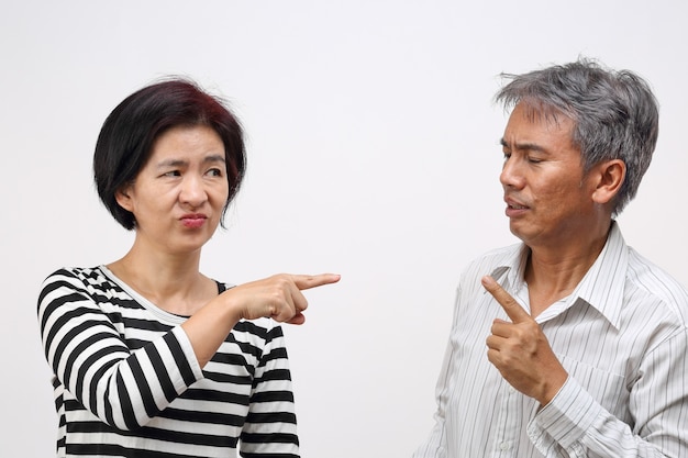 Woman pointing her finger against and blame her husband