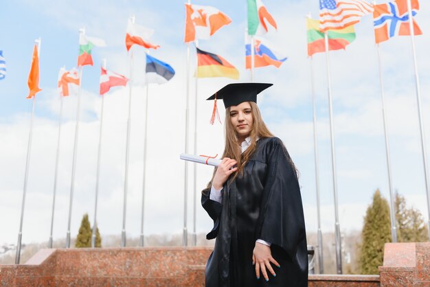 Woman portrait on her graduation day. University. Education, graduation and people concept.