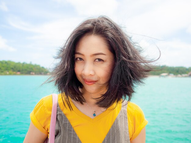 Woman portrait photo in windy beach