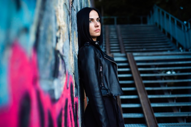 Woman portrait sitting on a evening stairs