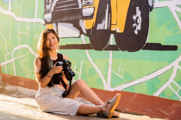 Woman portrait, Thai woman tourists like photography, love to travel, Travel on trip in holiday Watch the sunrise and morning mist in Yala Province, Southern Thailand, Asia.