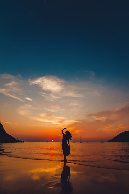 Woman posing on the beach