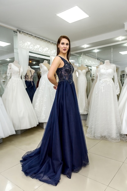 Woman posing in gorgeous long evening dress