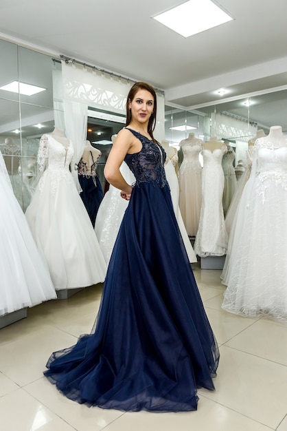 Woman posing in gorgeous long evening dress