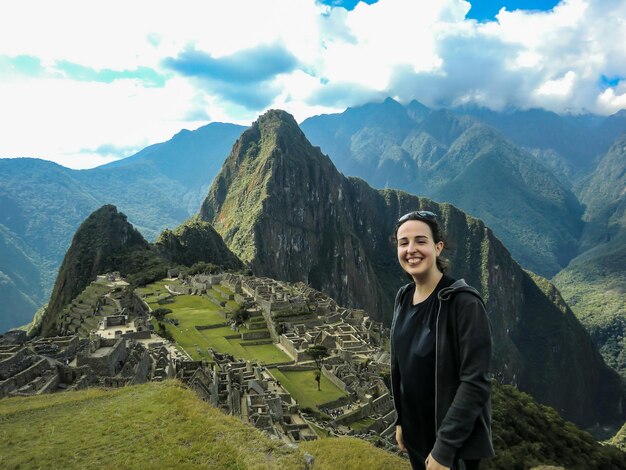 Woman posing in the ruins of Machu Picchu Cusco Peru