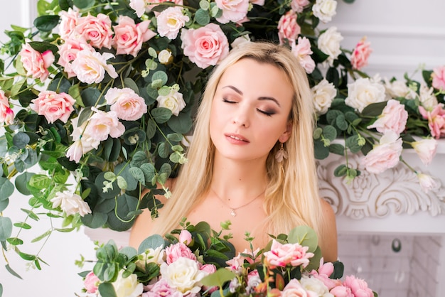 Woman posing in a studio with roses