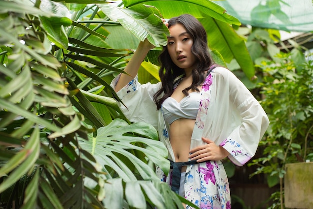 Woman posing in tropical forest resort