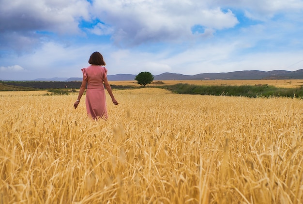 Woman posing in wheat field.