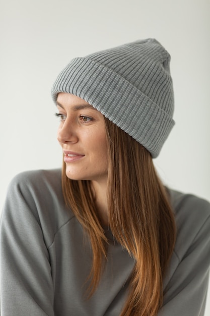 Woman posing in winter hat isolated