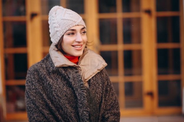 Woman posing in winter outside cafe