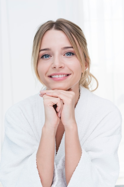 Woman posing with bathrobe in a spa