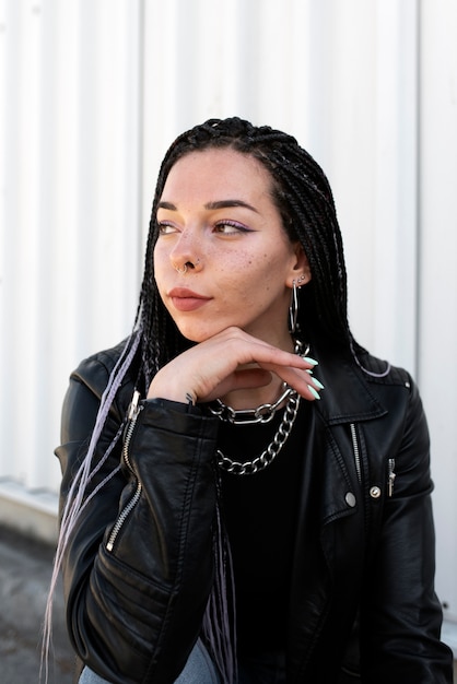 Woman posing with chain necklace medium shot