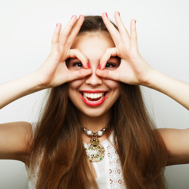 Woman posing with hands on the face