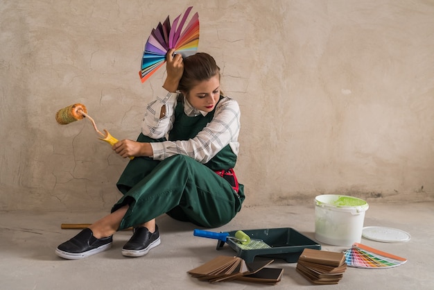 Woman posing with roller and colour swatch