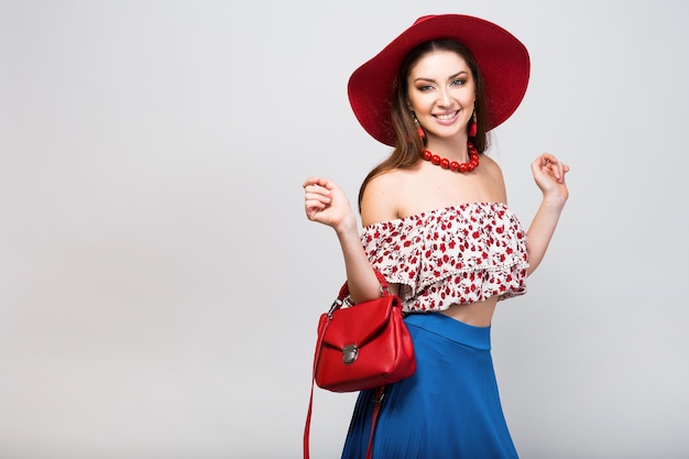 Woman posing with stylish footwear summer fashion and bag long legs shopping