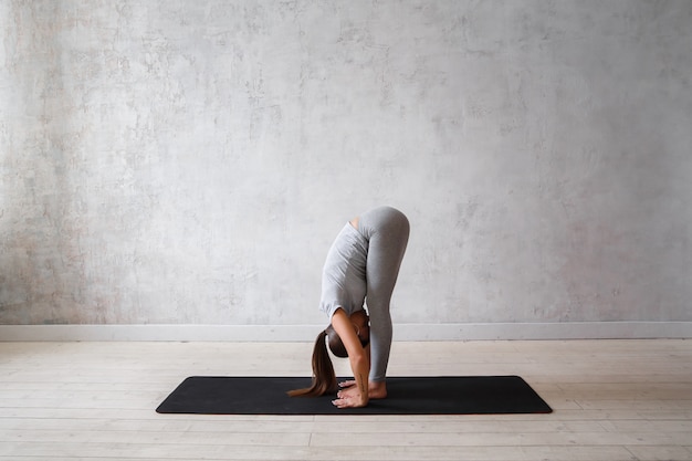 Woman practicing advanced yoga.