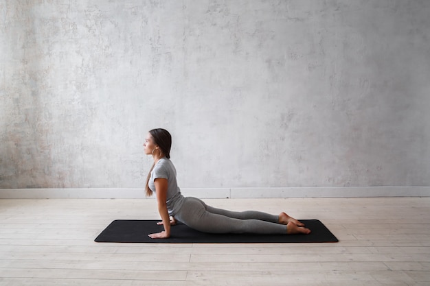 Woman practicing advanced yoga.