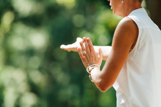 Woman Practicing Tai Chi Chuan Outdoors