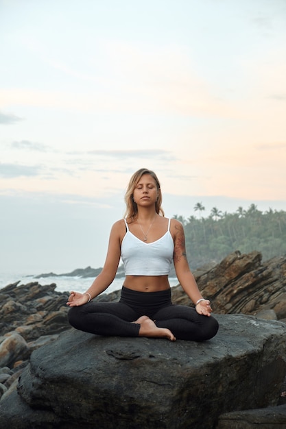 Woman Practicing Yoga in the Nature