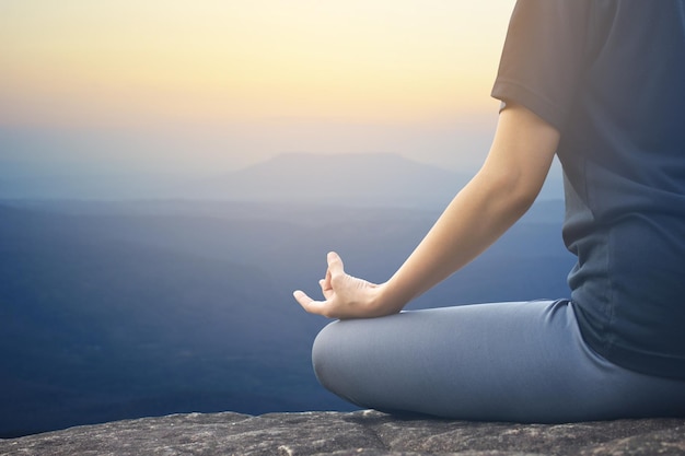 woman practicing yoga outdoors