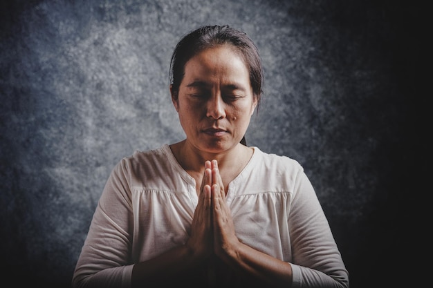 Woman pray for god blessing to wishing have a better life