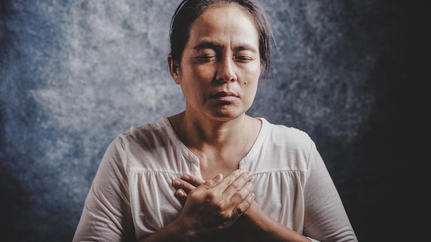 Woman Pray for god blessing to wishing have a better life