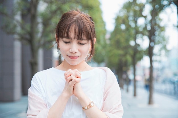 A woman in a prayer pose