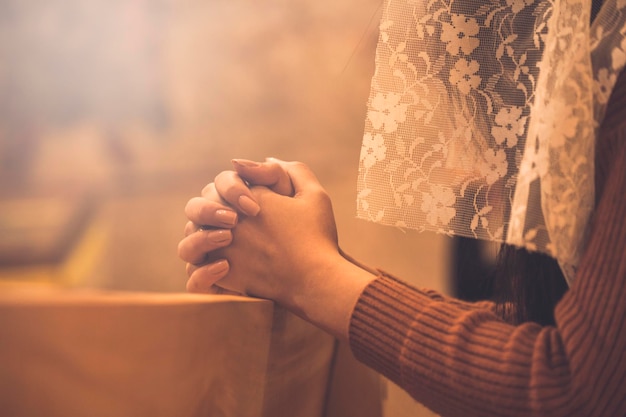 Woman praying in church